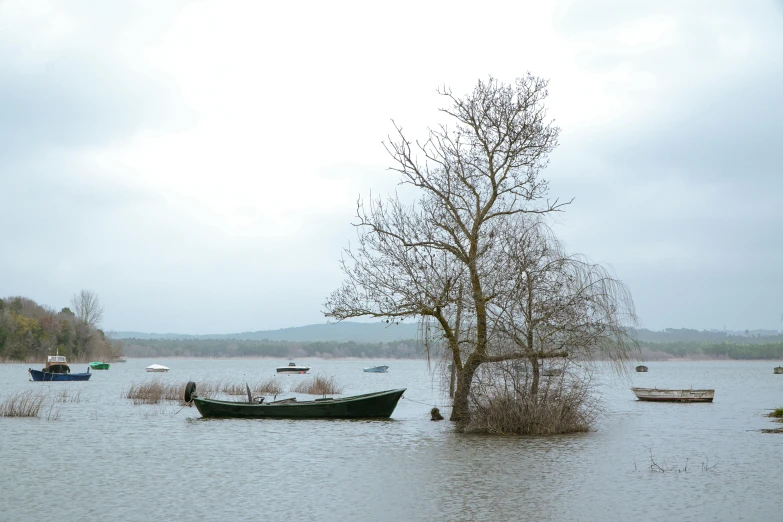 a river flooded with some boats on top of it