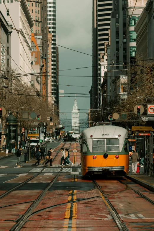 city street with trolley and buildings during daytime