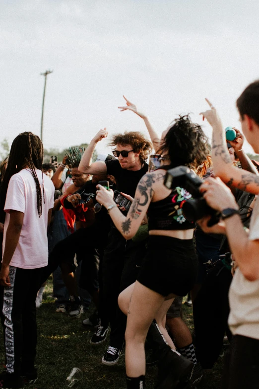 a woman dancing while other people are watching