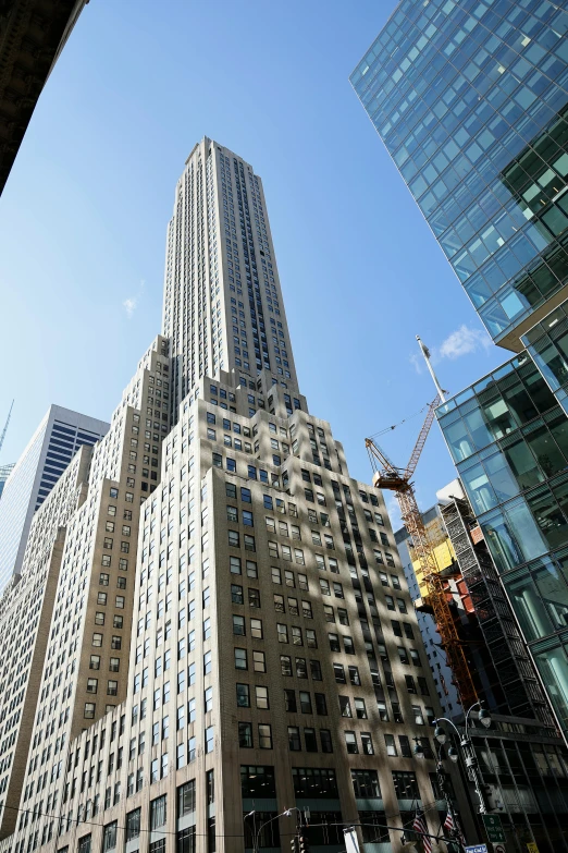 a view from across the street looking up at several high rise buildings