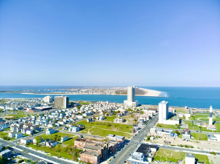 a city with a few buildings in front of the water