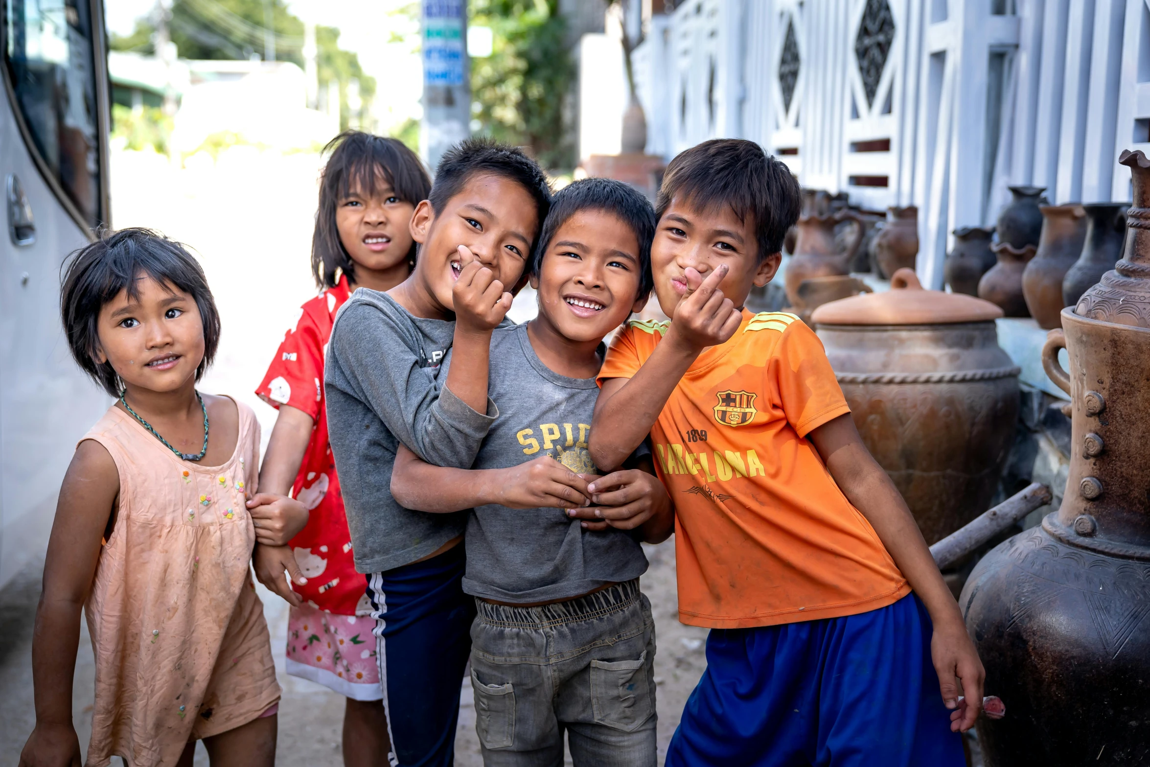 several children pose for a po outside