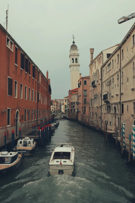 an old canal with some boats docked on it