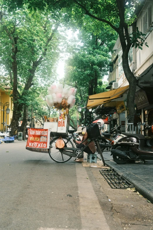 a street vendor stands near a street in a residential area