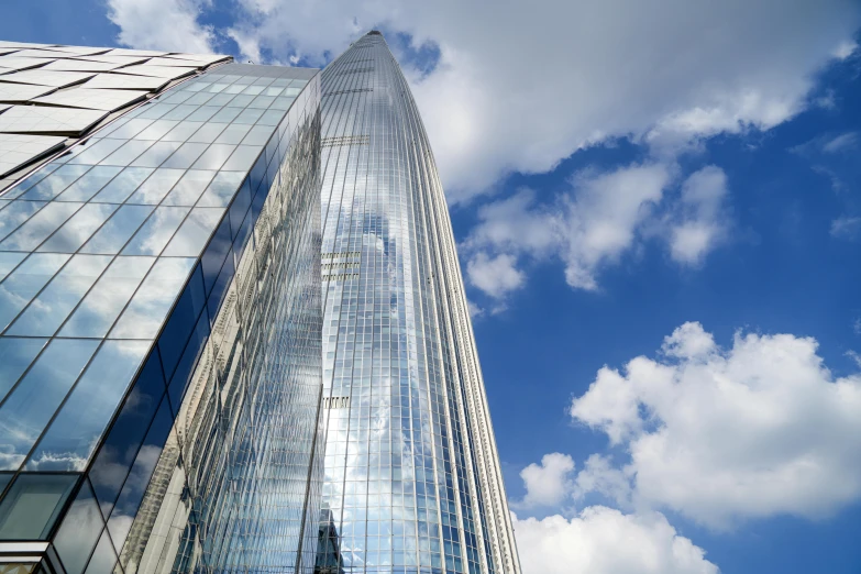 a very tall glass building with lots of windows