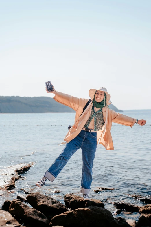 a woman with her arms outstretched over her legs