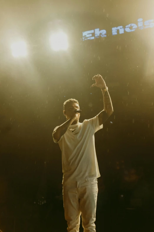 a man standing on top of a tennis court holding up a racquet