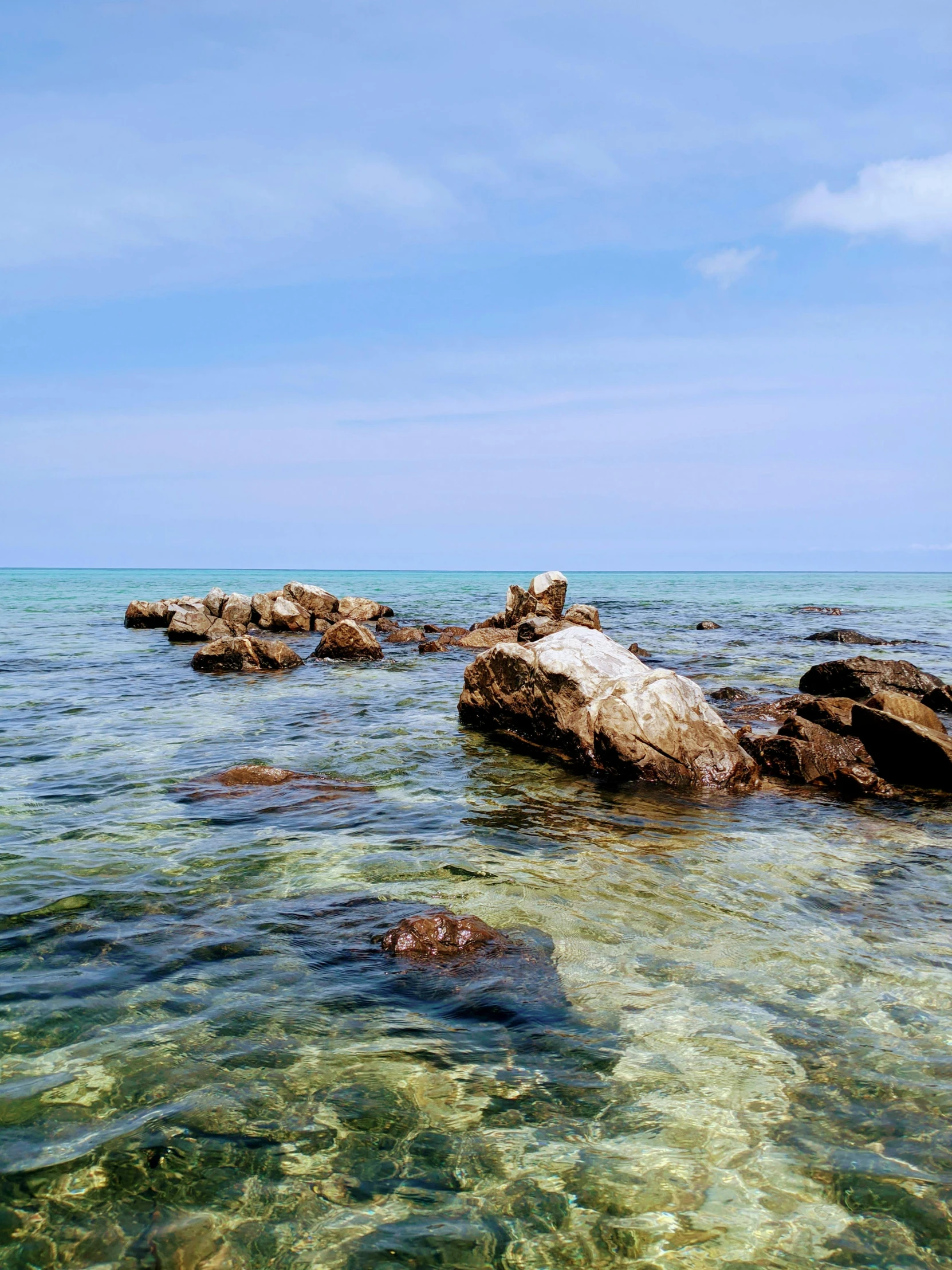 the water looks clear, crystal and clean at the beach