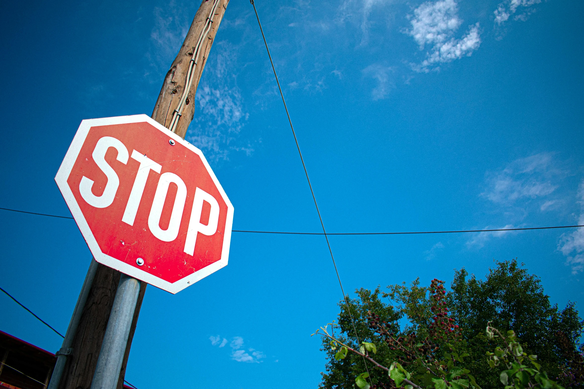 a stop sign with a building in the background