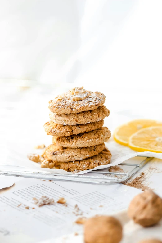 a stack of cookie cookies next to some lemon slices