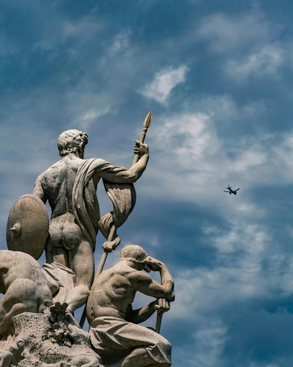 the statue is showing the flight plane on the horizon