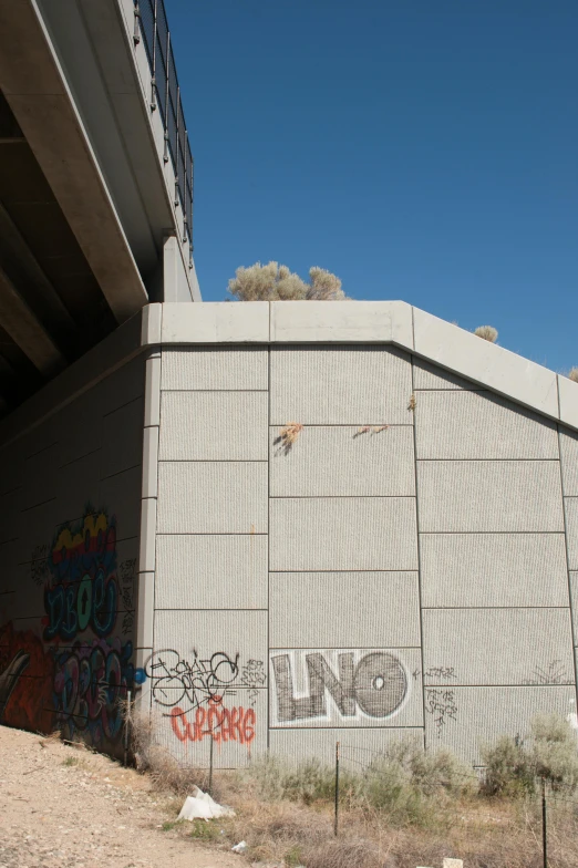 graffiti and a gate near an abandoned building