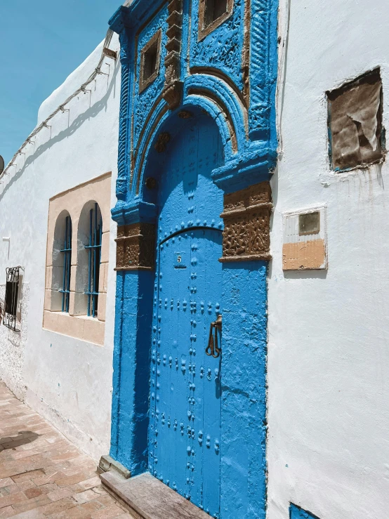 blue and white buildings with a large door