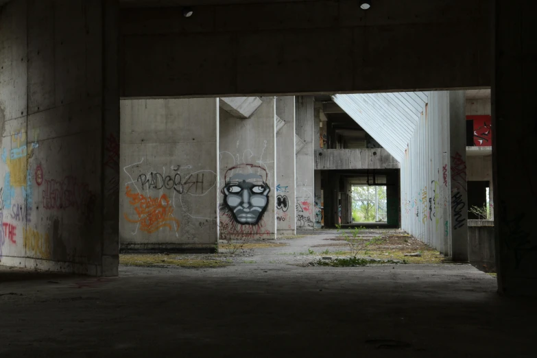 graffiti covering the wall and ceiling of a building