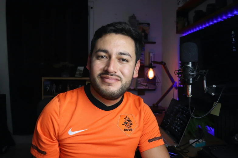 a man sitting next to a radio and an instrument