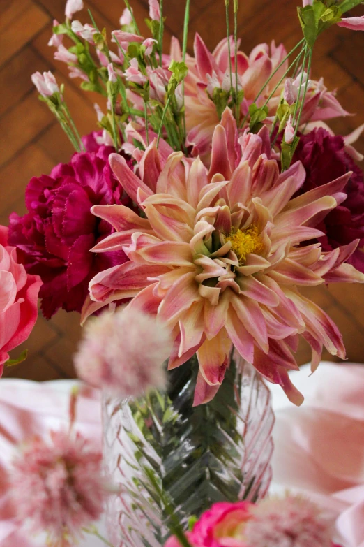 flowers are in a vase sitting on a table