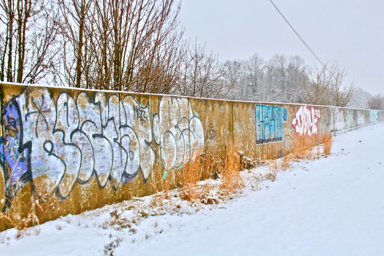 a side view of a wall covered in graffiti