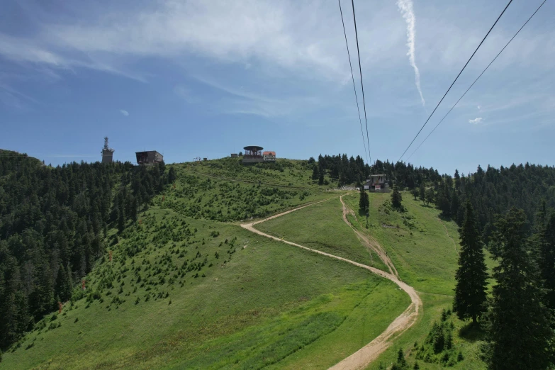 the view from the top of a steep hill of a ski area