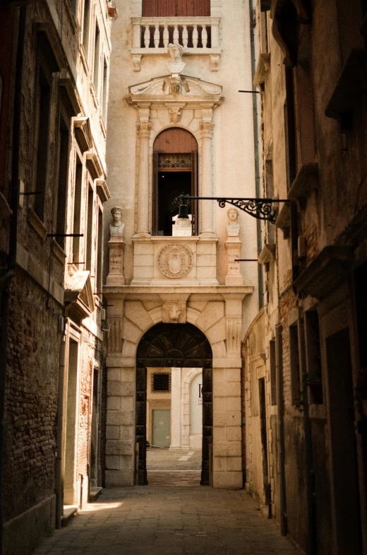 the door to a old building in an alley