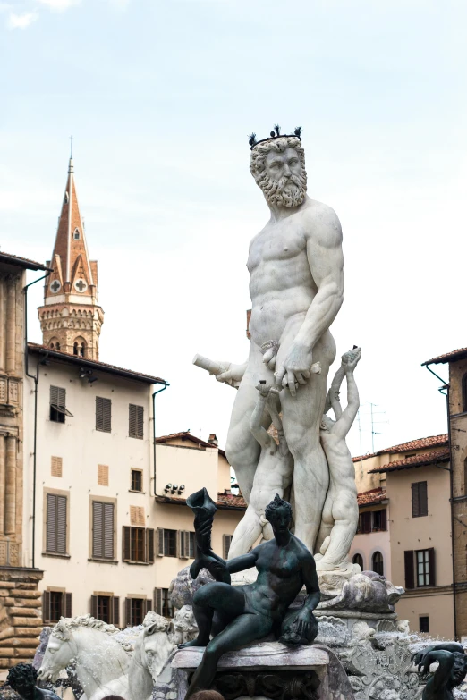 a statue with a crown is pictured in front of other statues