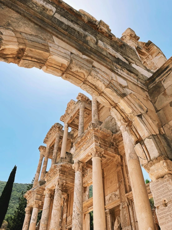 a very large arched stone structure on a sunny day