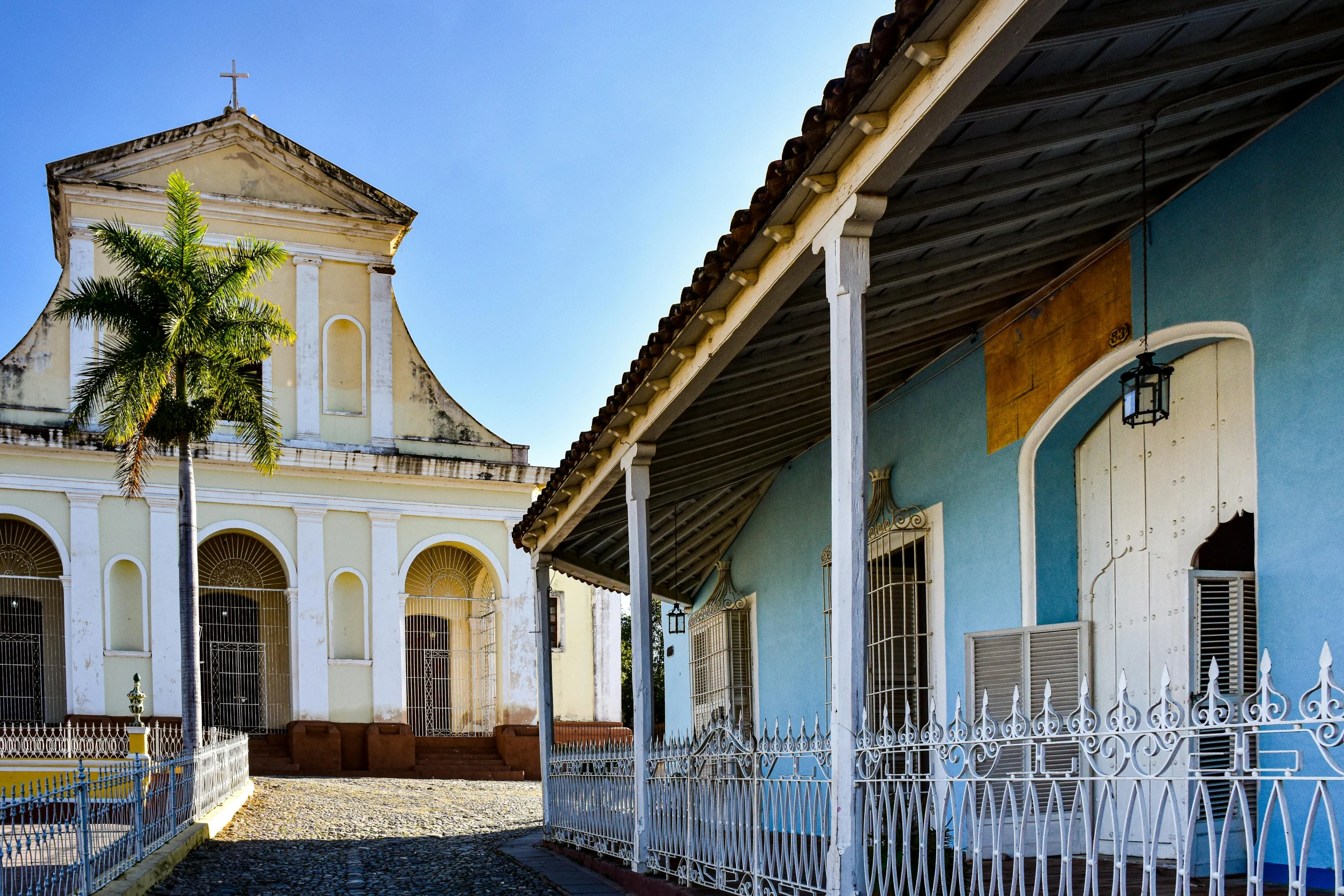 a white building with many doors and windows