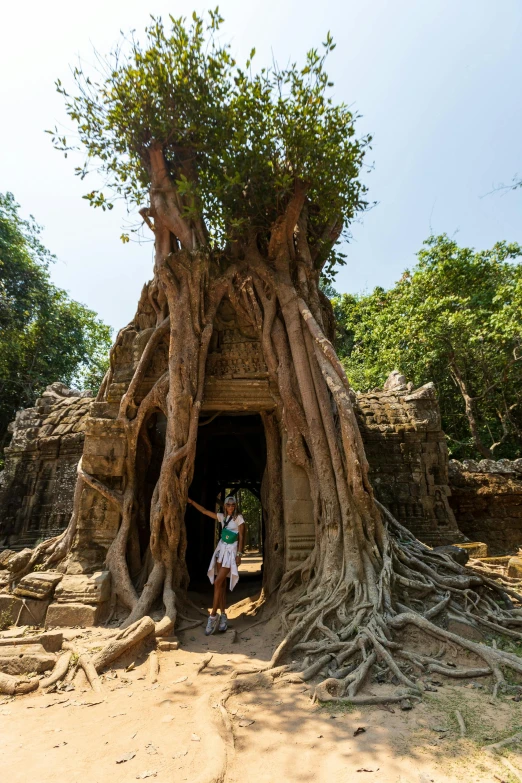 two people are standing in the entrance to an ancient structure