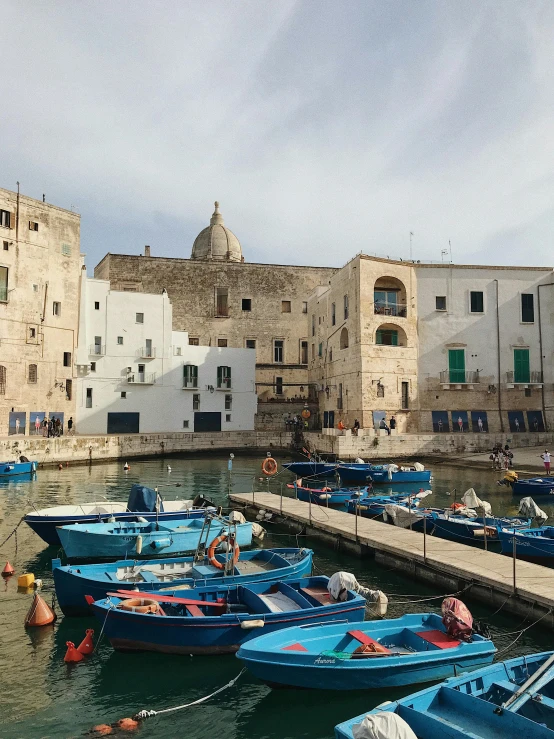 a view of some very pretty boats in the water