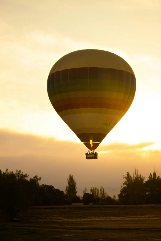 a colorful balloon flying in the sky