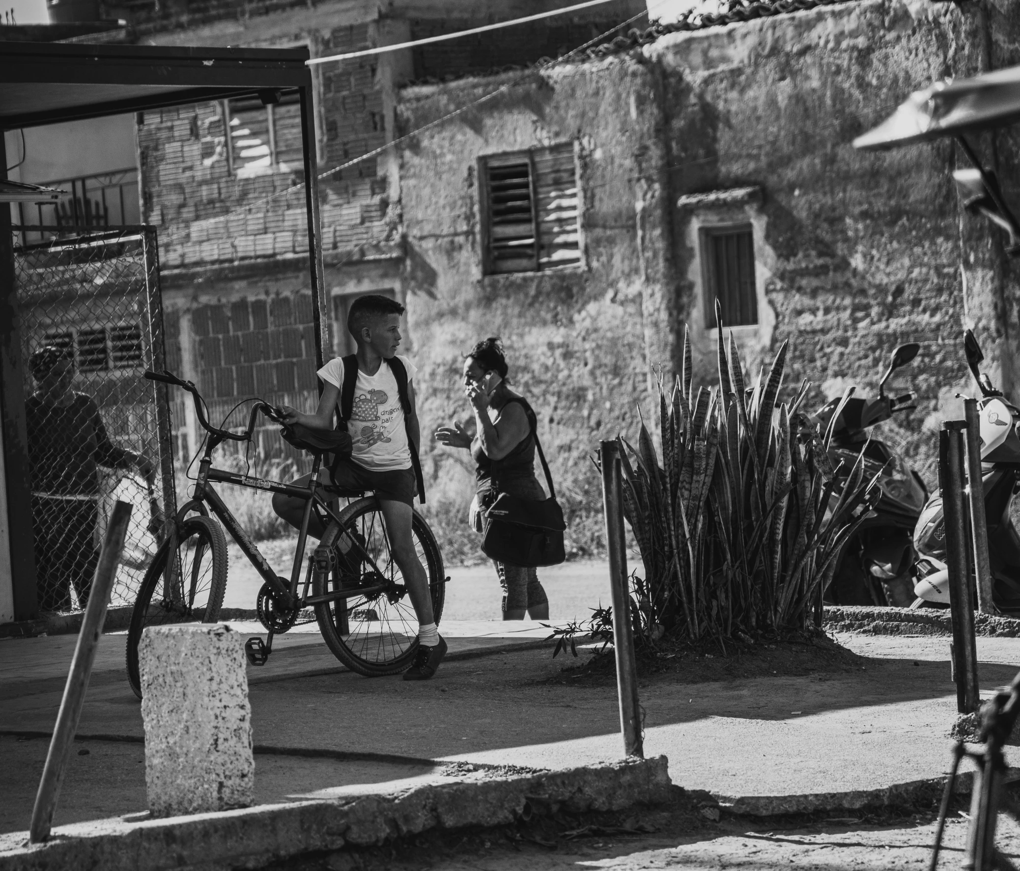 a person sitting on a bench in the street