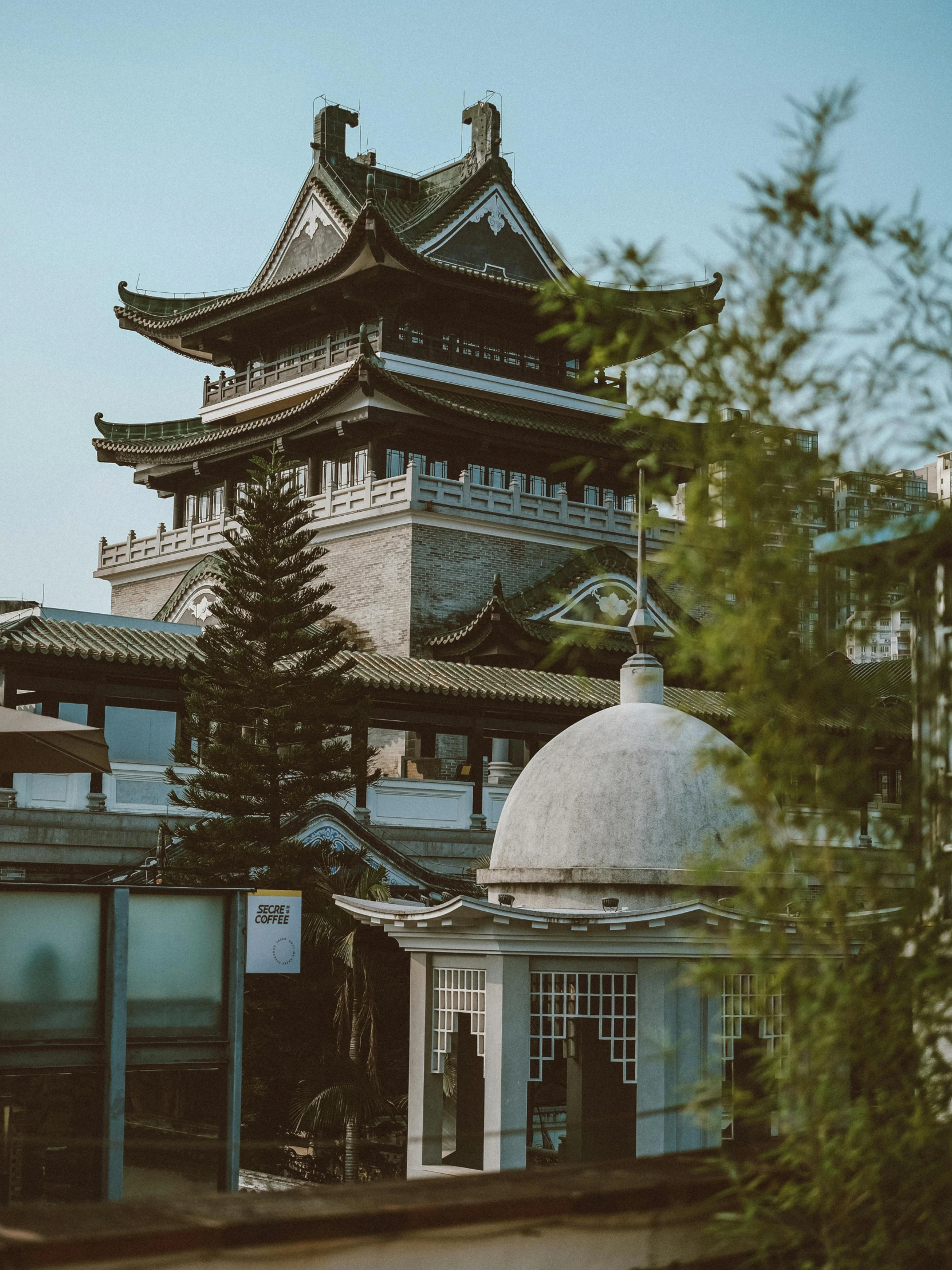 a large building sits on the side of a hill