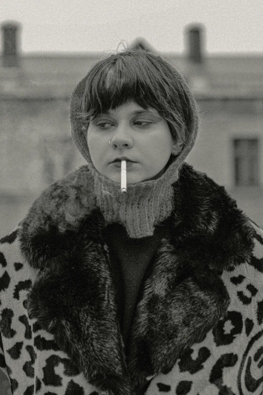 black and white pograph of a person smoking on a cigarette