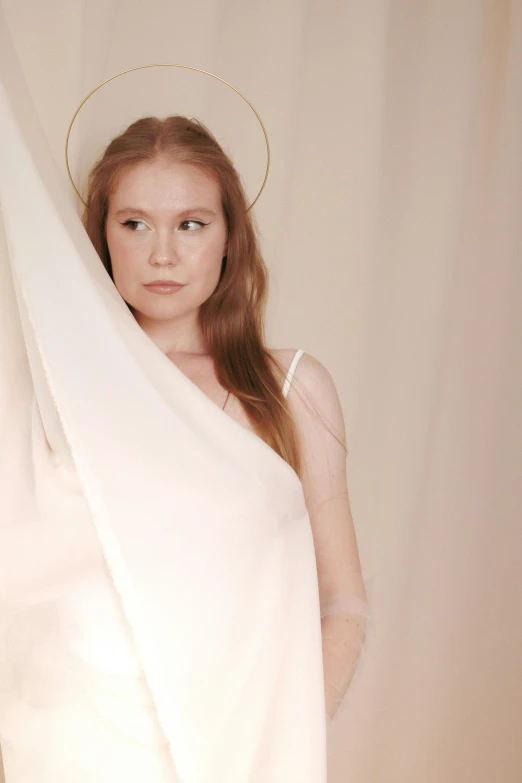 a beautiful woman standing in a bathrobe