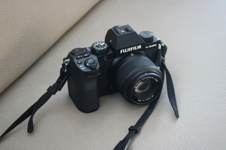 a close up of two different cameras with one being the focus on the other