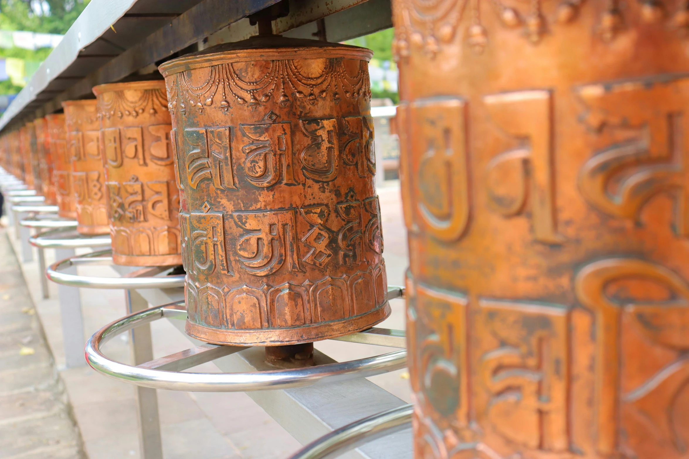 a line of asian style vases outside