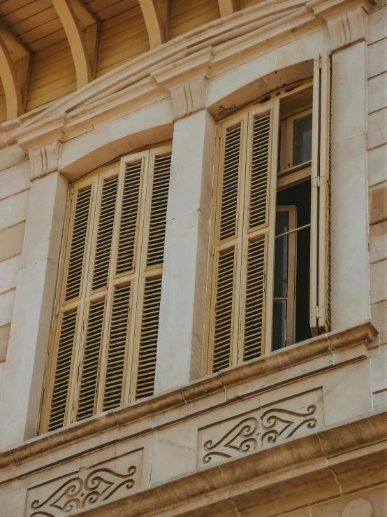 two window boxes on the side of a white building