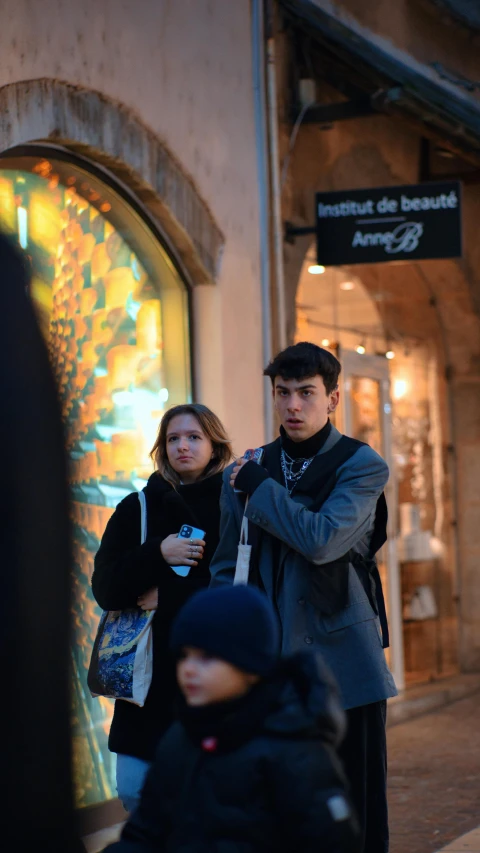 a man and woman are talking on a cell phone