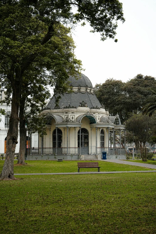 a park with a big white gazebo on top