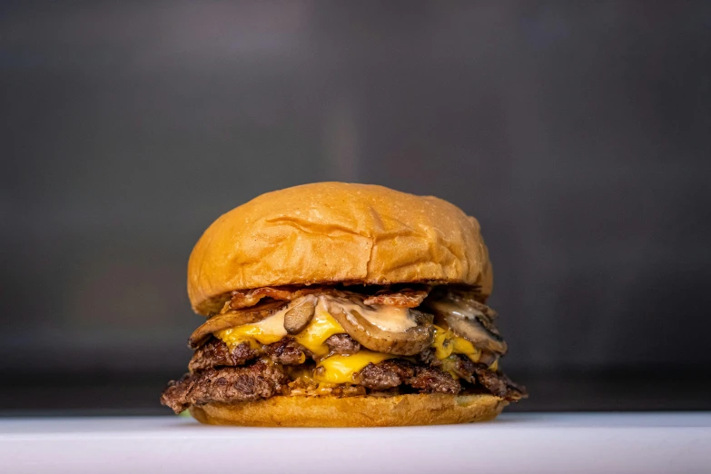 a meat and cheeseburger from the burger joint