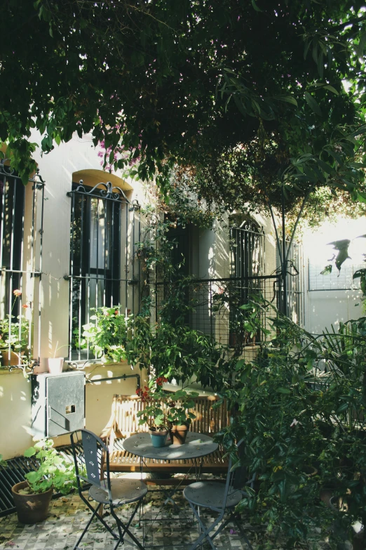 the back yard features a bench and a table and chairs