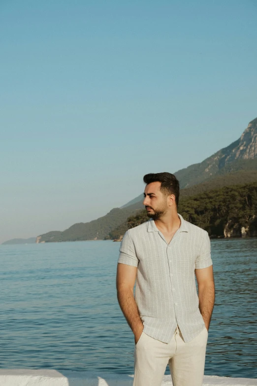 a man that is standing in the water by himself