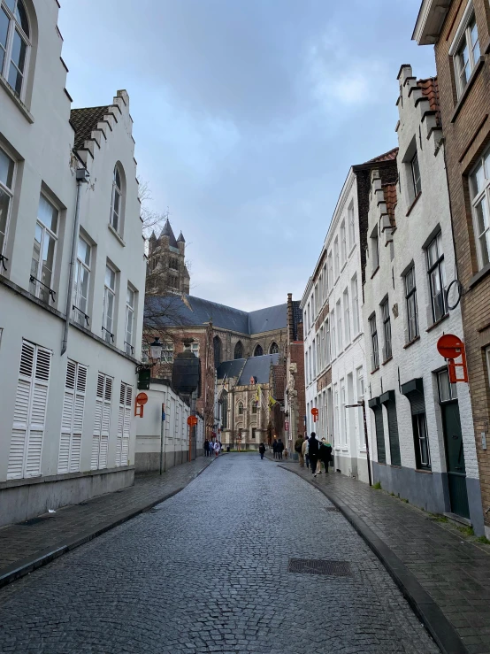 several old buildings on a cobblestone street