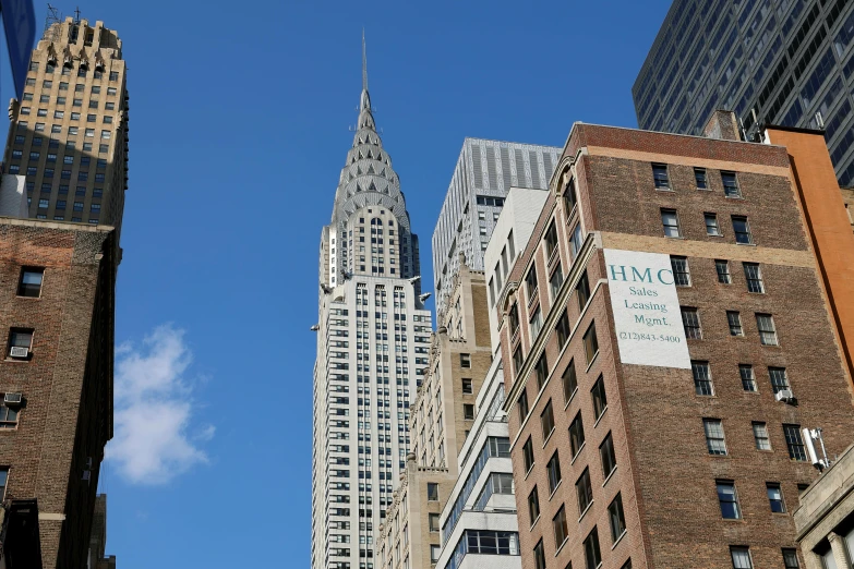 a couple of very tall buildings on a city street