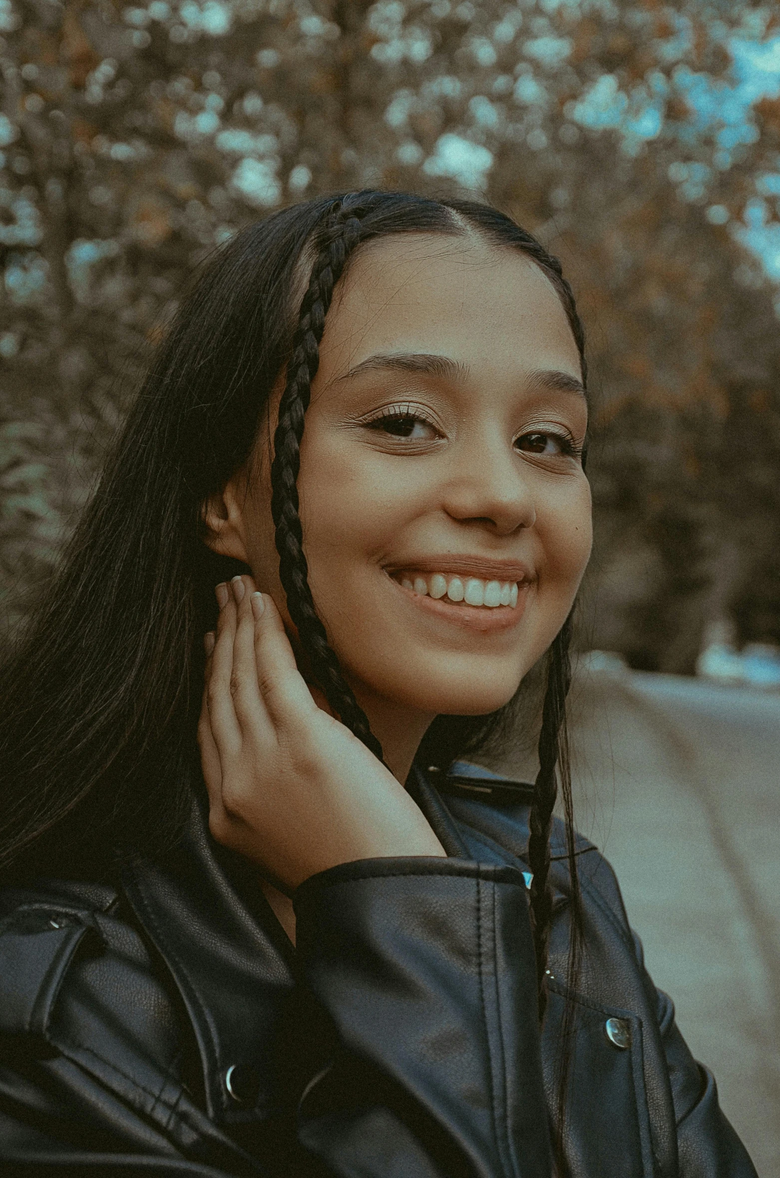 young woman with id hair smiling for po