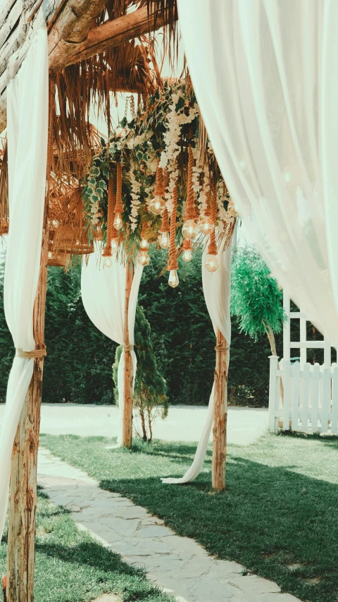 a wedding at a private location with wooden and drap curtains