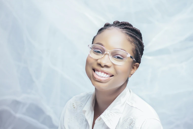 a girl wearing glasses and posing for the camera