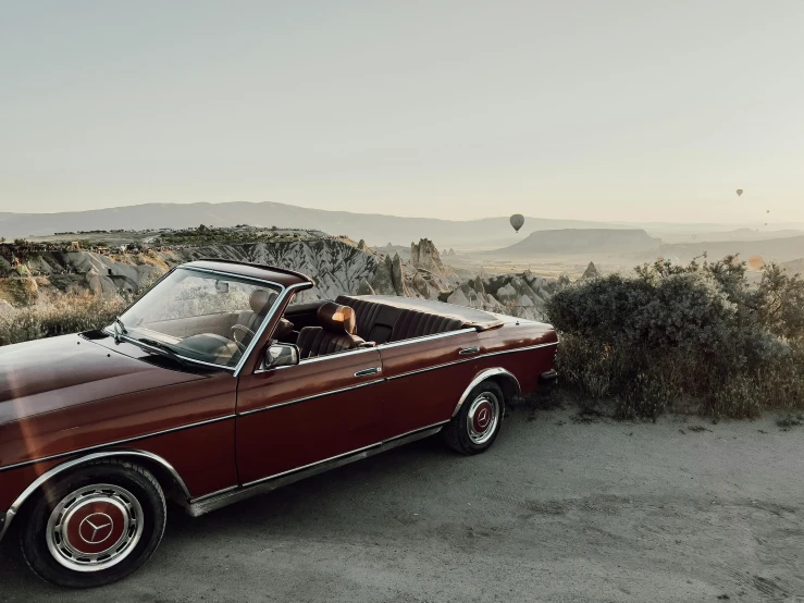 a car parked in the middle of the desert