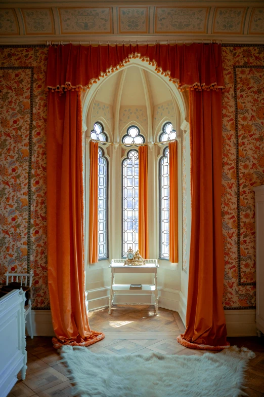 a room that has curtains in front of two windows