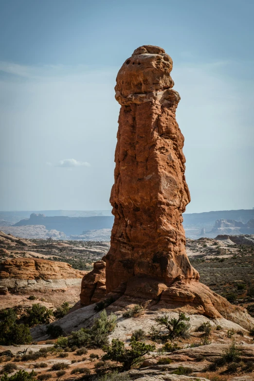 a large stone structure in the desert during a sunny day