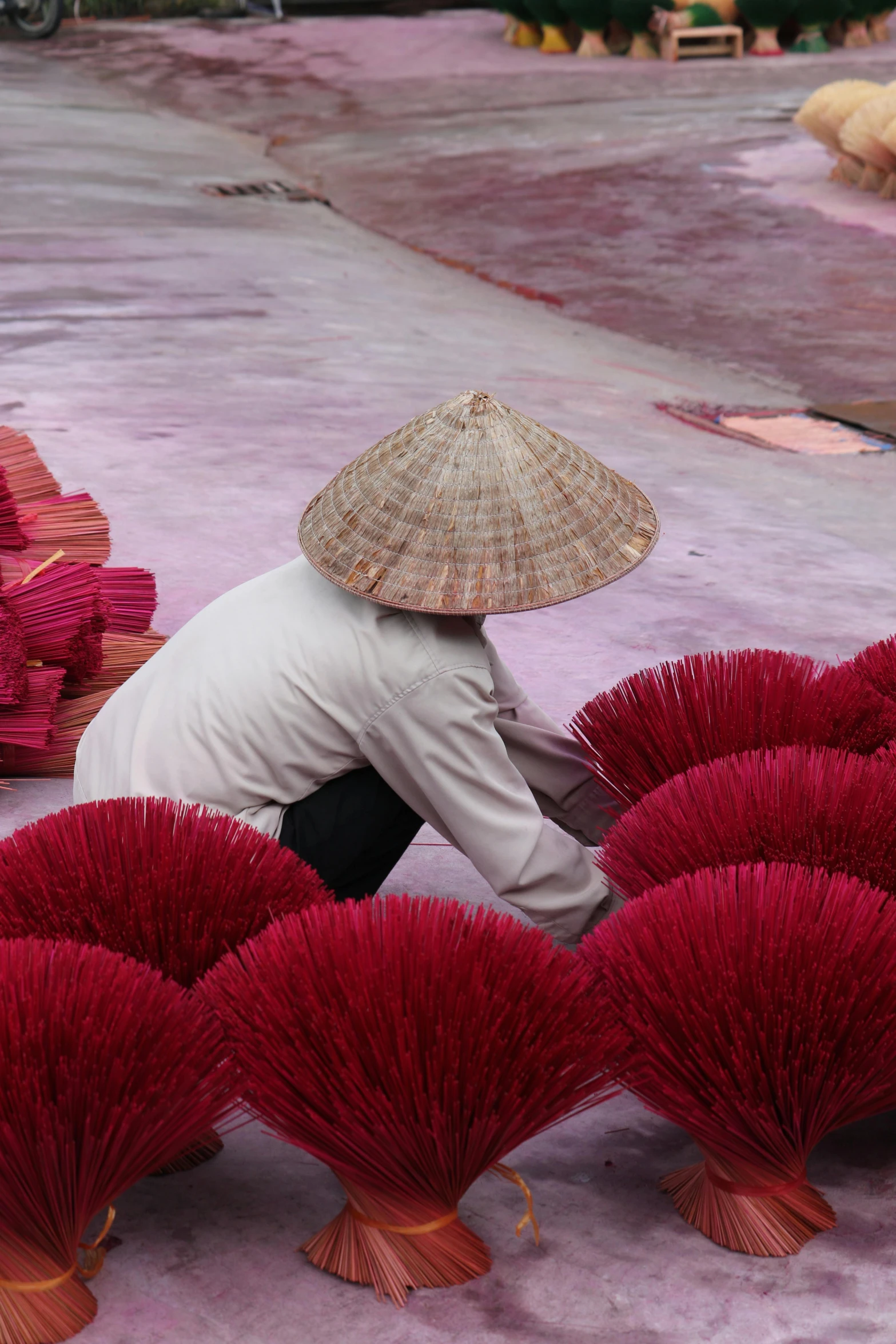 a person kneeling down with an umbrella on